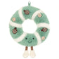 A plush, circular Jellycat Amuseables Pinecone Wreath with a smiling face, dangling legs, and decorative berry accents.