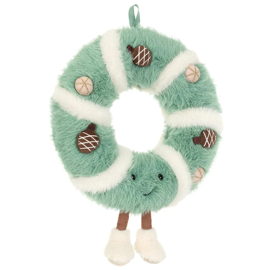 Jellycat Amuseables Pinecone Wreath featuring a smiling face, dangling legs, and decorative pinecones and spheres.