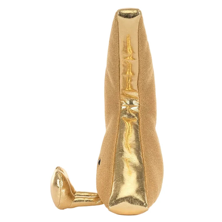 A yellow and tan Jellycat Amuseables Zapperty Lightning Bolt plush toy, shaped like a stylized elongated lightning bolt, shown upright with one end resting on the surface.