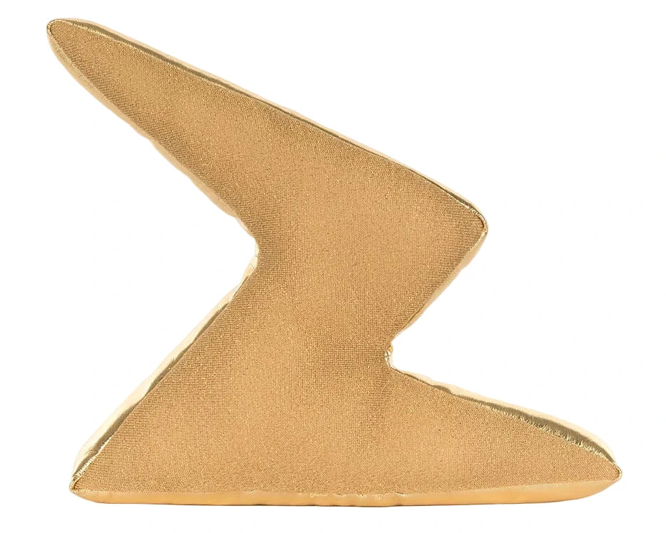 The Jellycat Amuseables Zapperty Lightning Bolt is a gold, zigzag-shaped decorative pillow with a shiny finish, inspired by the plush toy, shown standing upright on a white background.