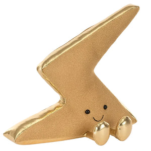 The Jellycat Amuseables Zapperty Lightning Bolt is a plush toy shaped like a gold lightning bolt, featuring two small feet, black eyes, and a smiling face.