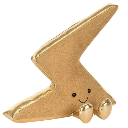 The Jellycat Amuseables Zapperty Lightning Bolt is a plush toy shaped like a gold lightning bolt, featuring two small feet, black eyes, and a smiling face.