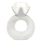 The Jellycat Amuseables Diamond Ring is a plush toy shaped like a diamond ring, with a soft grey band and white fabric diamond—an adorable, whimsical gift inspired by vintage boutique finds.