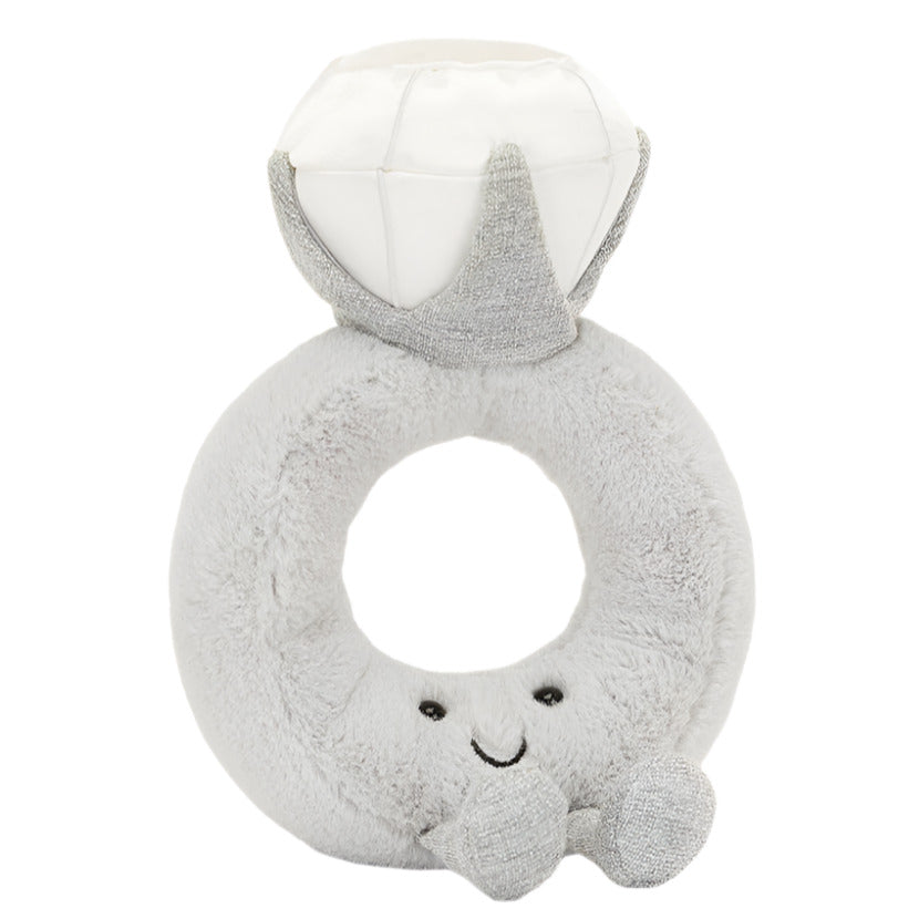 The Jellycat Amuseables Diamond Ring plush, featuring a smiling face and small arms, is perfect for playful proposals or adding whimsical charm to your vintage boutique.