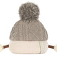 The Amuseables Pomilly by Jellycat is a knit beige and gray hat with cable pattern, big pom-pom, side ties, and white pom-poms—perfect for a cozy Christmas party!.