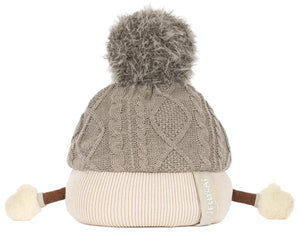 The Amuseables Pomilly by Jellycat is a knit beige and gray hat with cable pattern, big pom-pom, side ties, and white pom-poms—perfect for a cozy Christmas party!.
