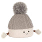 Amuseables Pomilly by Jellycat: a cream-colored marshmallow plush with a gray pom-pom hat, mittens, and smile—perfect for festive holiday fun!.