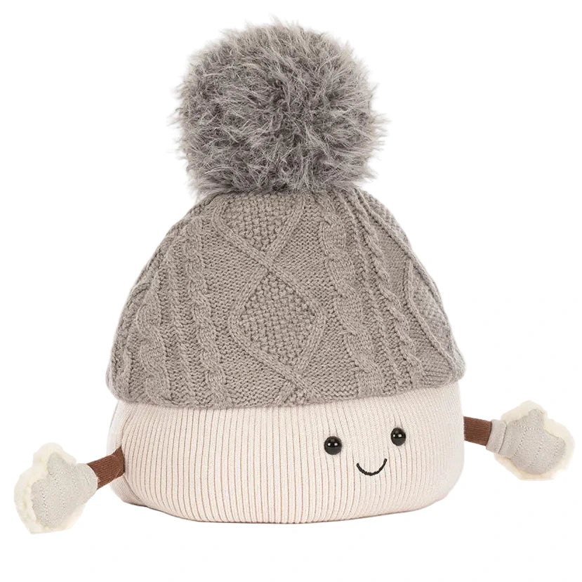 Amuseables Pomilly by Jellycat: a cream-colored marshmallow plush with a gray pom-pom hat, mittens, and smile—perfect for festive holiday fun!.