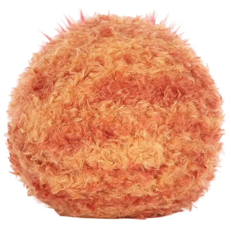 The Jellycat Amuseables Planet Mars plush, featuring a round shape and orange-yellow fluffy texture, sits against a white background.