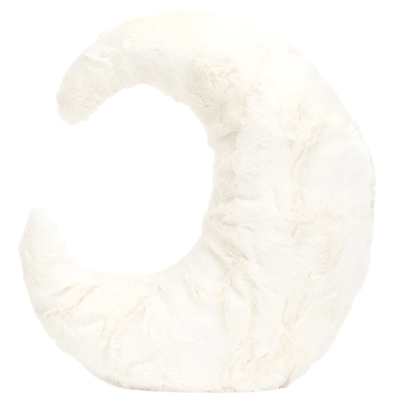 A plush pillow in the shape of a crescent moon, covered in soft white faux fur, is displayed against a plain white background. The Amuseables Moon by Jellycat adds a whimsical touch to any room.