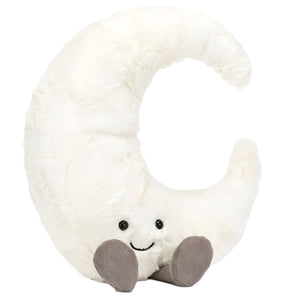 The Jellycat Amuseables Moon plush toy, by Jellycat, is designed in the shape of a crescent moon with a cheerful smiling face and two tiny gray feet, set against a white background.