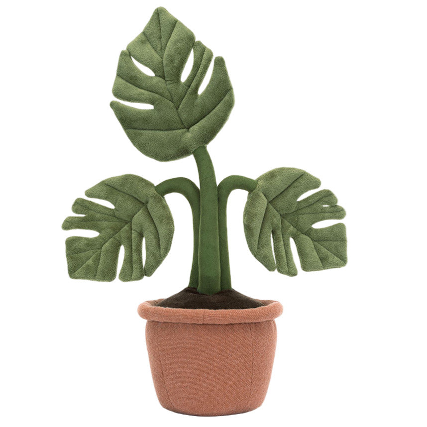The Jellycat Amuseables Monstera Plant is a plush toy with three big green leaves and a soft brown pot, perfect for adding charm to any desk.