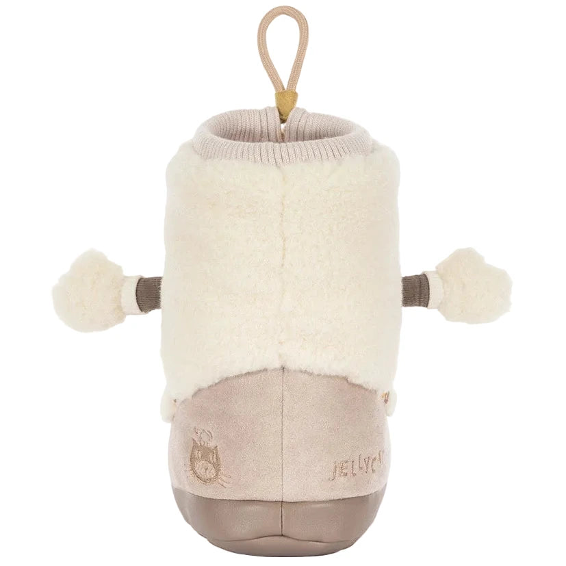 The Amuseables Perta Snow Boot by Jellycat is a beige and cream baby bootie with fluffy upper, pom-poms, and a loop—ideal for cozy Christmas decor.