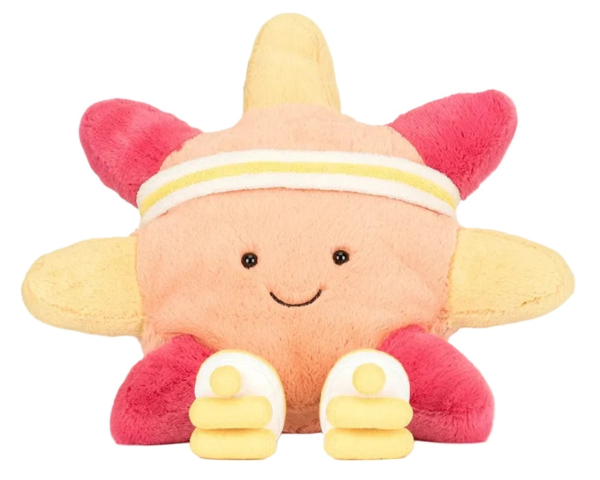 The Jellycat Amuseables Sun 'Roller Skates' is a plush toy with a smiley face, sporty headband, two small dumbbells, and bright yellow and pink rays—perfect for roller skating fun along the boardwalk.