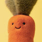 Close-up of the Jellycat Amuseables Carrot plush, featuring a cheerful face, black eyes, and a green leafy top against a yellow background.