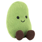 The Jellycat Amuseables Soyella Edamame Bean is a plush toy shaped like a green bean, featuring black eyes, a smiling mouth, and brown legs, sitting upright.