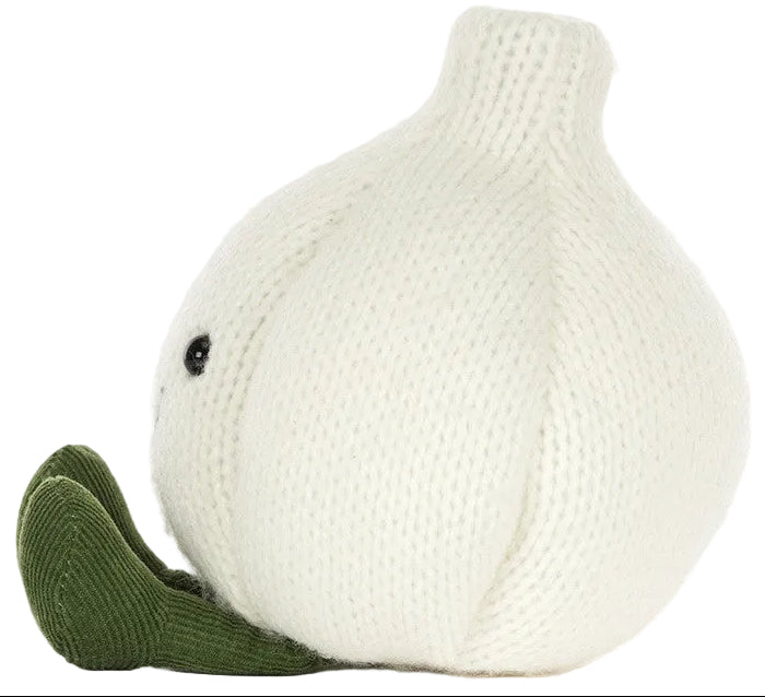 The Amuseables Garlic plush toy by Jellycat features a knitted design shaped like a white garlic bulb with a green stem and two small black eyes, making it a delightful addition to any Halloween party.