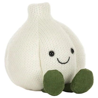 Add a playful touch to your Halloween party décor with the Jellycat Amuseables Garlic—a plush toy shaped like a white garlic bulb, featuring black eyes, a cheerful smile, and green corduroy feet, shown sitting upright on a white background.
