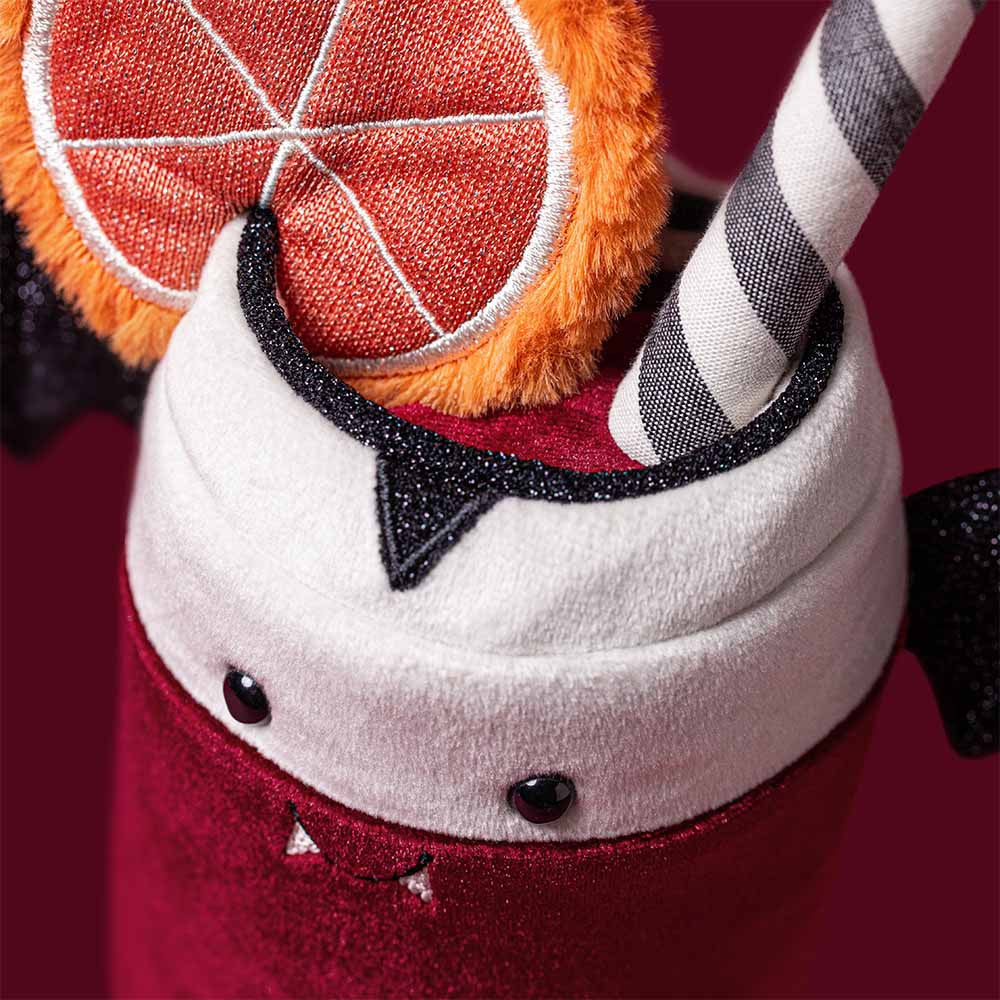 The Jellycat Amuseables Vampop Drink is a whimsical Halloween plush from Jellycat, designed as a cup with felt fangs, bat wings, a citrus slice decoration, and a striped straw—making it the perfect addition to your seasonal decor.