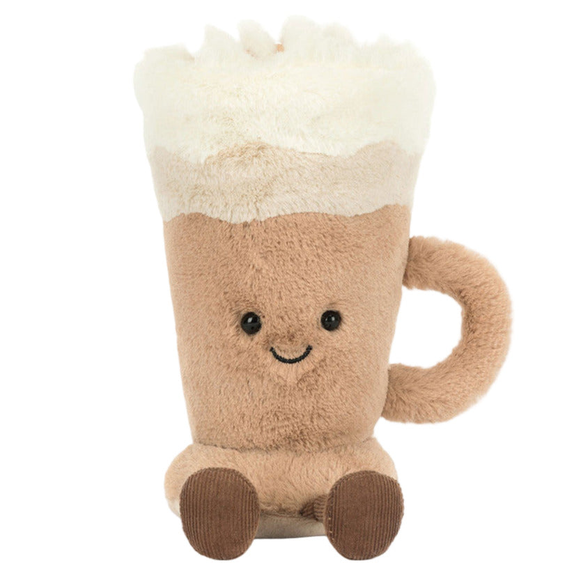 The Amuseables Latte by Jellycat is a plush toy shaped like a beer mug, featuring a smiling face, tan body, white foam top with latte art, and a right-side handle—an adorable addition to any collection.