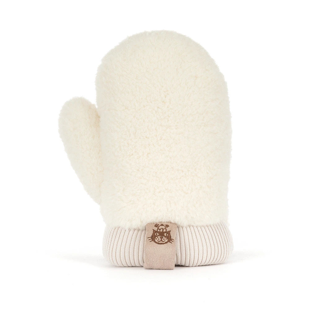White fuzzy mitten with a ribbed beige cuff and Jellycat Amuseables Fitswell Mitten tag, featuring a cat face, displayed upright on a plain white background.