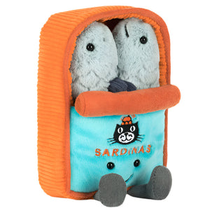 Two plush sardines cuddle inside a soft blue and orange tin with "SARDINAS" and a cartoon cat face embroidered on the front. Shop the Jellycat Amuseables Sardine Tin at Swinley Boar's Boar Store!.