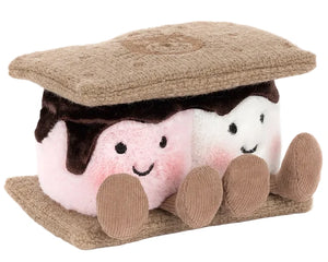 The Jellycat Amuseables S'mores is a plush shaped like a s'more, with two smiling marshmallows featuring pink cheeks, chocolate, and graham cracker pieces on the top and bottom.
