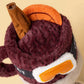 Jellycat Amuseables Mullover Spiced Drink plush toy with a cinnamon stick, orange slice topper, and stitched goggles on the front.
