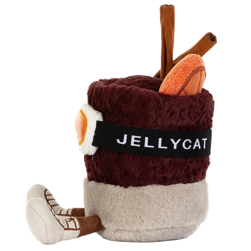 Amuseables Mullover Spiced Drink by Jellycat: A plush toy styled as a spiced drink with cinnamon sticks, orange slice, “JELLYCAT” sash, and plush legs and feet.