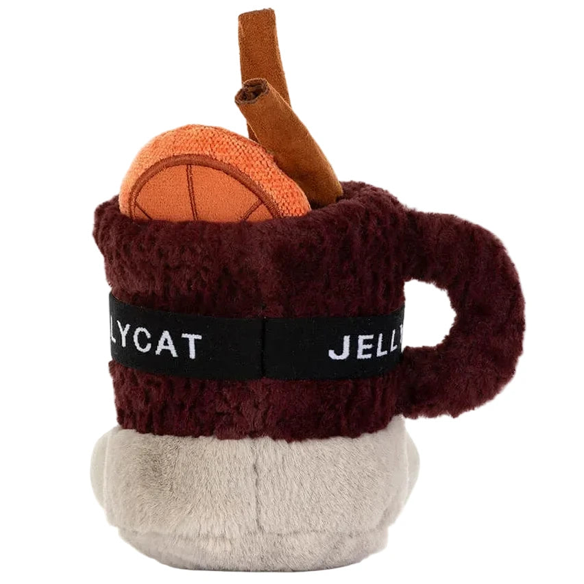 The Jellycat Amuseables Mullover Spiced Drink is a plush mug with dark red fur, an orange ball, brown stick, and a “JELLYCAT” label around the middle.