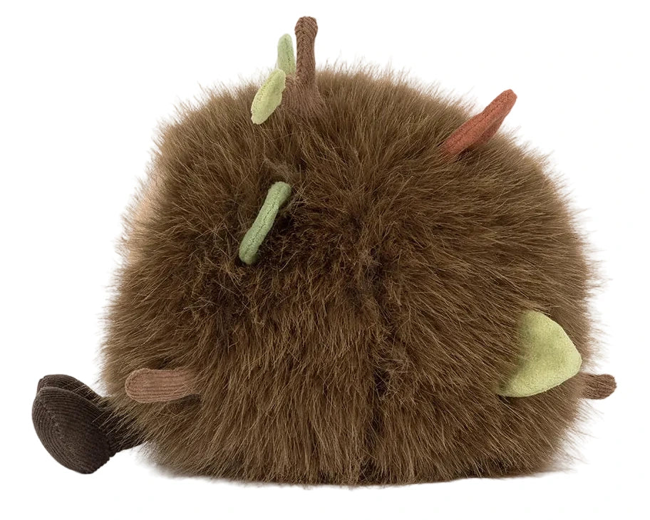 The Jellycat Amuseables Mulshi Woodland Floor is a round, fluffy brown plush toy featuring small fabric branches and leaves, inspired by treasures from the woodland floor.
