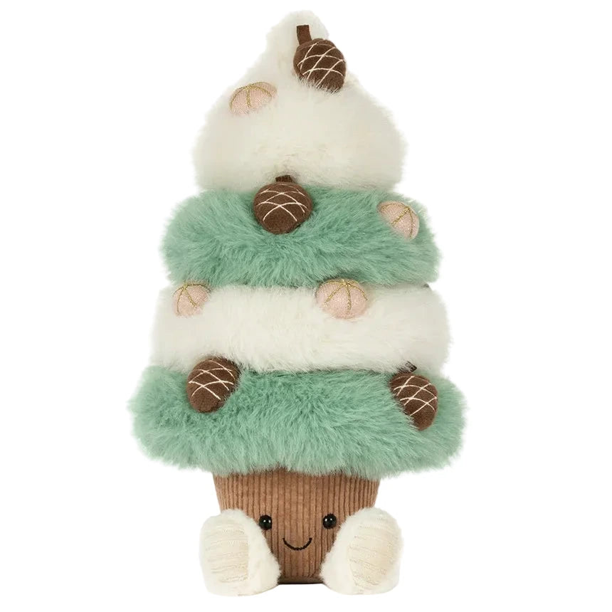 A Jellycat Amuseables Pinecone Tree plush featuring green and white fluffy tiers decorated with small pinecones, standing in a brown pot with a smiling face.
