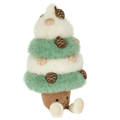 Jellycat Amuseables Pinecone Tree plush with tiered, alternating green and white fuzzy branches decorated with small acorns, sitting on a brown corduroy base with two dangling legs and a smiling face.