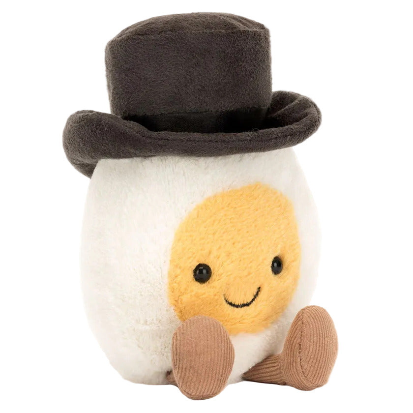 Bring home the Jellycat Amuseables Boiled Egg Groom plush, featuring a smiling face, brown feet, and a smart black top hat.