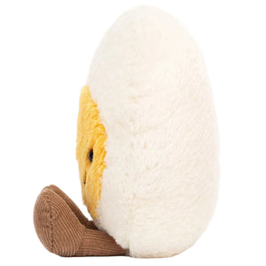 Plush toy shaped like a half-peeled banana with a yellow face, white outer layer, and brown bottom, shown from the side—this cheerful Jellycat creation is as playful as the Amuseables Boiled Egg Happy by Jellycat.