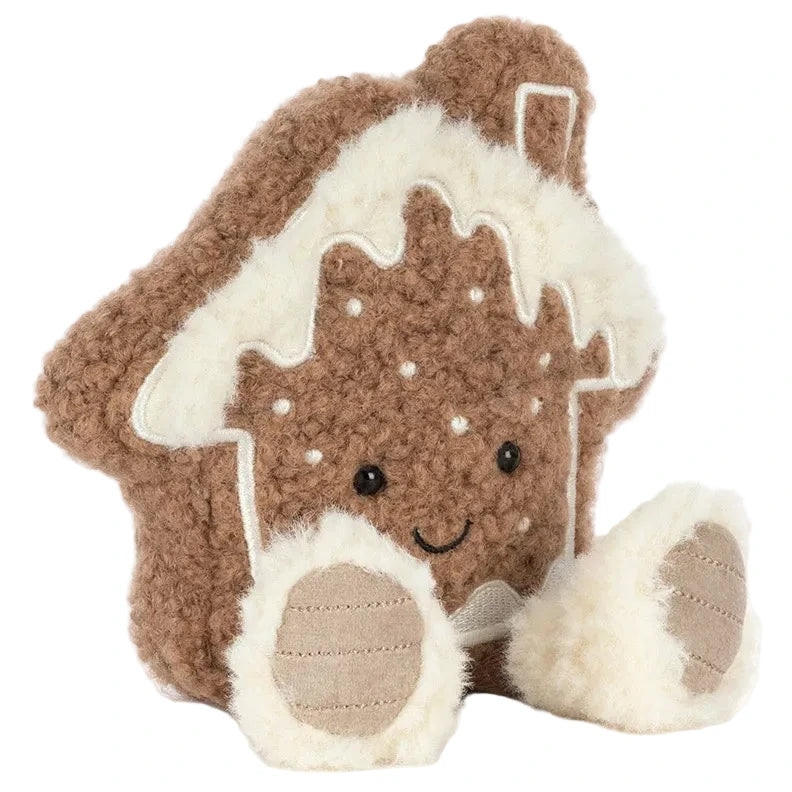 Jellycat Amuseables Molasi Cookie plush in the shape of a gingerbread house with a smiling face, white icing trim, and two soft feet.