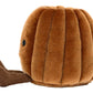 The Jellycat Amuseables Carole Canele is a brown canelé-shaped plush toy with a corduroy stem and small black eye, inspired by the pastry, shown on a white background.