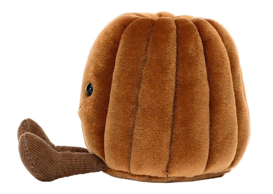 The Jellycat Amuseables Carole Canele is a brown canelé-shaped plush toy with a corduroy stem and small black eye, inspired by the pastry, shown on a white background.