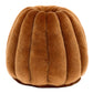 A plush, round brown velvet Amuseables Carole Canele by Jellycat, featuring vertical ridges and resembling a bundt cake, is set against a white background.