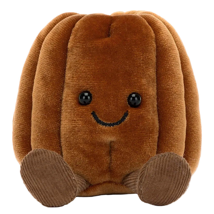 Meet Amuseables Carole Canele by Jellycat—a soft, cuddly plush shaped like a brown canele pastry, featuring a smiling face, black button eyes, and little brown feet.