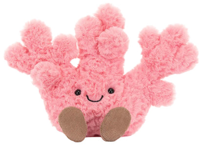 A plush Amuseables Coral toy with a smiling face and small brown feet.