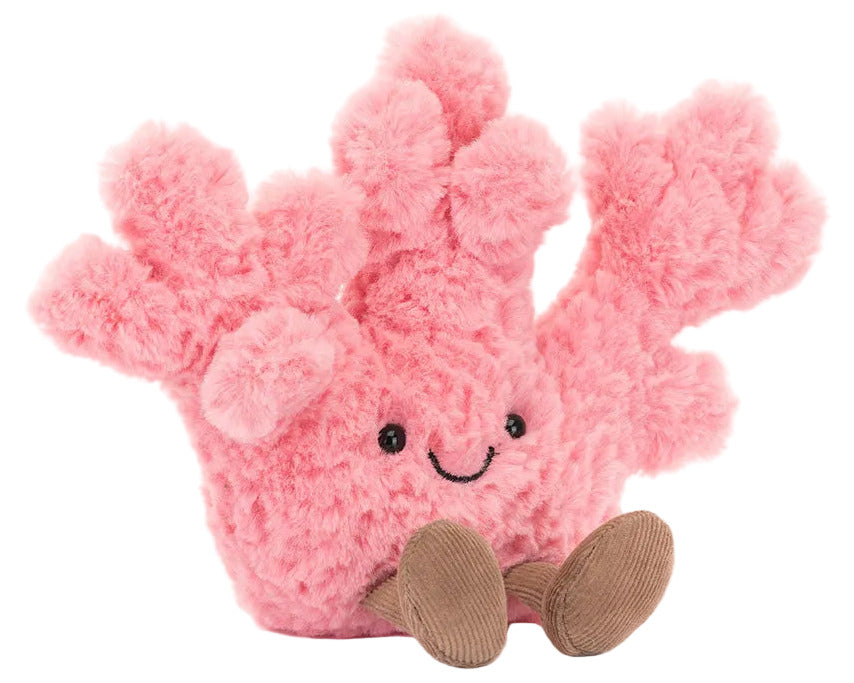 Plush pink Jellycat Amuseables Coral toy with a smiling face and small brown dangling legs.