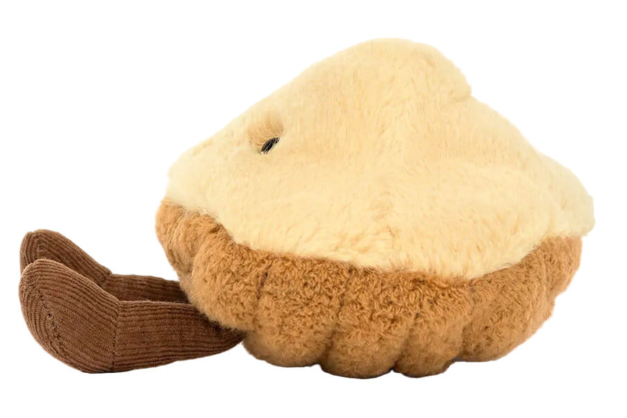 The Jellycat Amuseables Margaux Madeleine is a plush toy shaped like a madeleine cake, with a soft textured design by Jellycat.