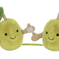 The Jellycat Amuseables Pair of Olives features two plush olives with green leaves, brown stems, small arms, and smiling faces joined by a short green string—perfect for you and your favorite magician’s assistants.