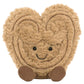The Jellycat Amuseables Philippe Palmier is a smiling, cartoon-style plush heart with fuzzy tan fabric, embroidered lines, black button eyes, and two brown feet—part of the playful Amuseables collection.