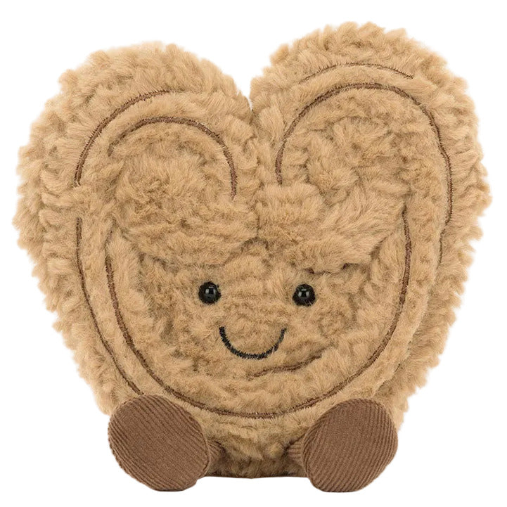 The Jellycat Amuseables Philippe Palmier is a smiling, cartoon-style plush heart with fuzzy tan fabric, embroidered lines, black button eyes, and two brown feet—part of the playful Amuseables collection.