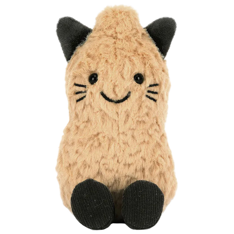An Amuseables Peanut ‘Cat’ plush stuffed animal by Jellycat sits upright on a white background, featuring tan fur, black ears and feet, a stitched smile, and charming whisker details. This adorable creation is perfect for both cuddling and display.
