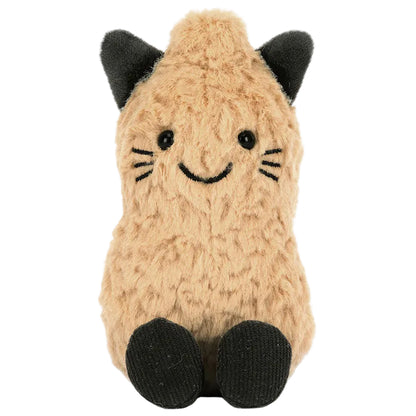 An Amuseables Peanut ‘Cat’ plush stuffed animal by Jellycat sits upright on a white background, featuring tan fur, black ears and feet, a stitched smile, and charming whisker details. This adorable creation is perfect for both cuddling and display.
