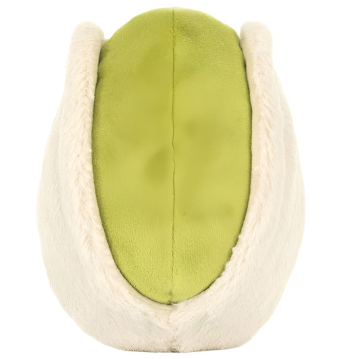 A plush toy by Jellycat, Amuseables Horatio Pistachio, featuring a light green center and cream-colored, furry sides, resembling the back view of a pistachio slice.