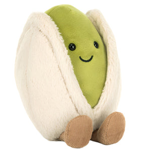 The Jellycat Amuseables Horatio Pistachio is a plush toy with a green center, cream shell, black eyes, and brown feet—sitting upright and as delightful as a box of pistachio truffles.